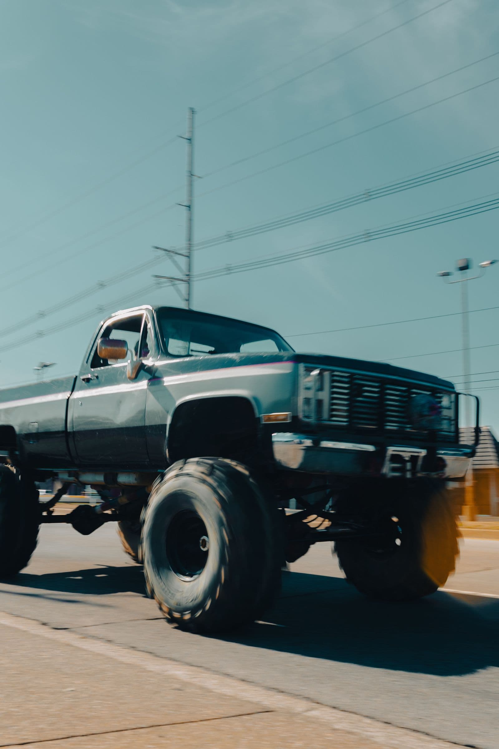 Lifted square-body Chevy on oversized off-road tires